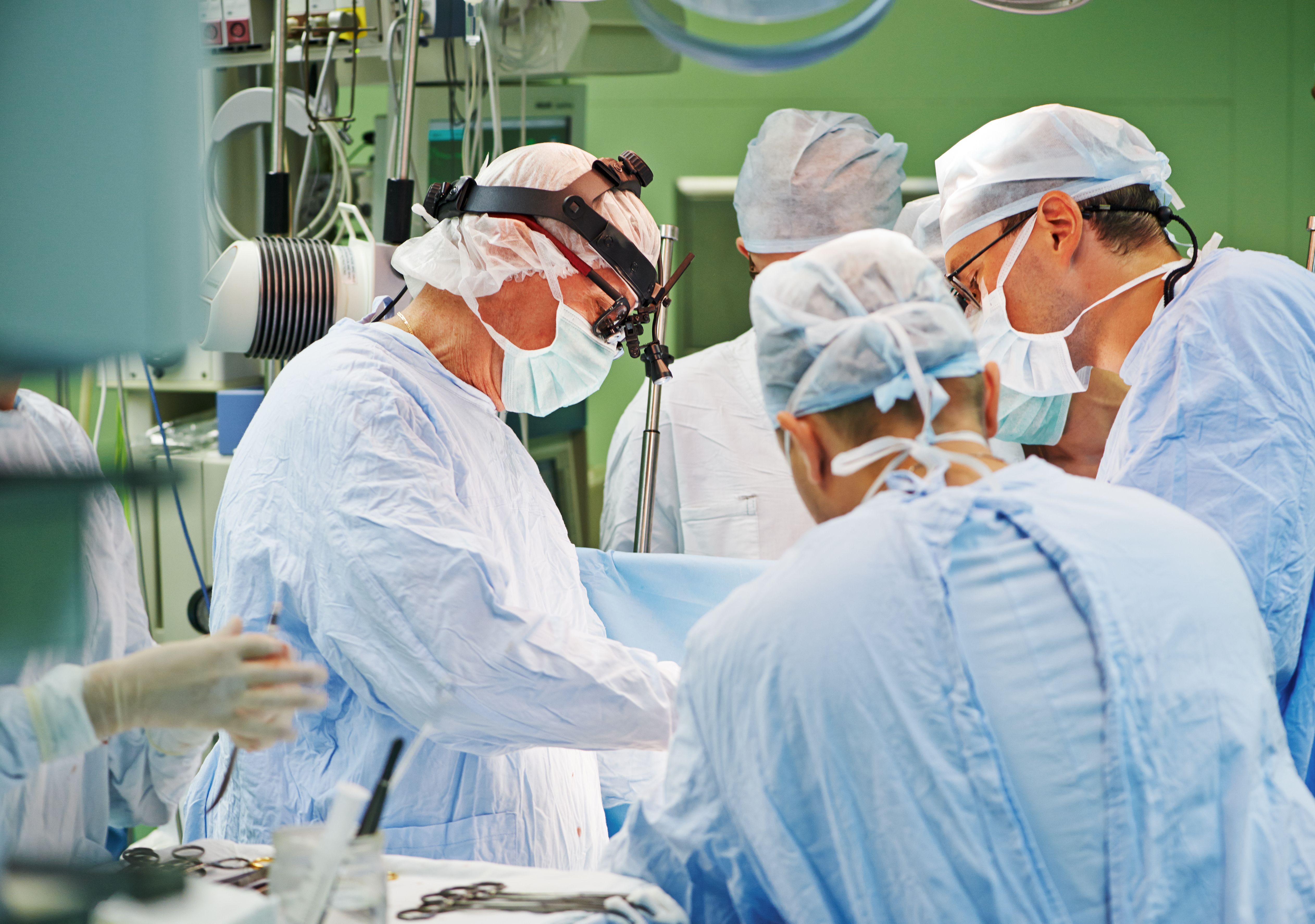 Photo of doctors performing surgery